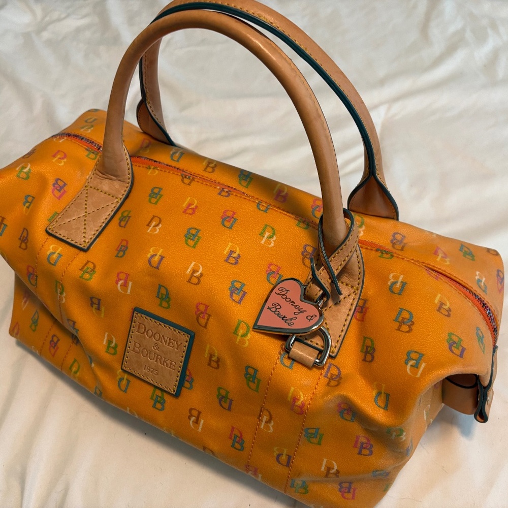 Dooney & Bourke. An Orange Coated Canvas and Leather Rainbow Logo "Y2K" Handbag
